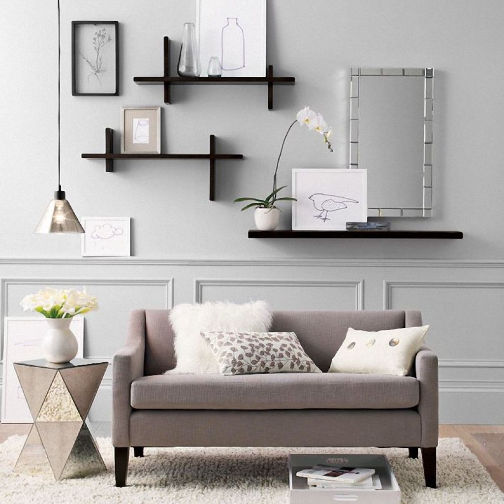 Đặt cây cỏ hoặc cây xanh trên kệ treo tường để tạo okking.con thiên nhiên và làm dịu màu sắc trong phòng